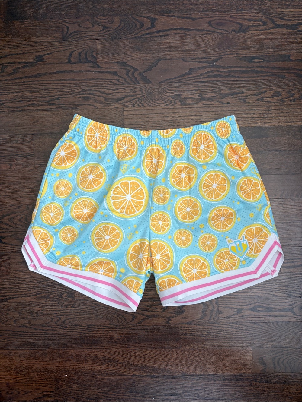 Men's Light Blue Athletic Shorts with Citrus Print and Pink Trim